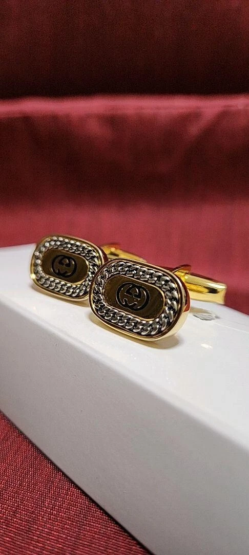 Boutons de manchette imbriqués Gucci motif chaîne G or couleur argent noir bijoux pour hommes