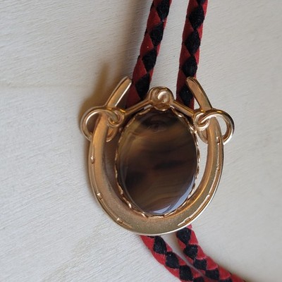 Western Tigers Eye Gold Tone Horseshoe Snaffle Bit Bolo Tie Black And Red Cord