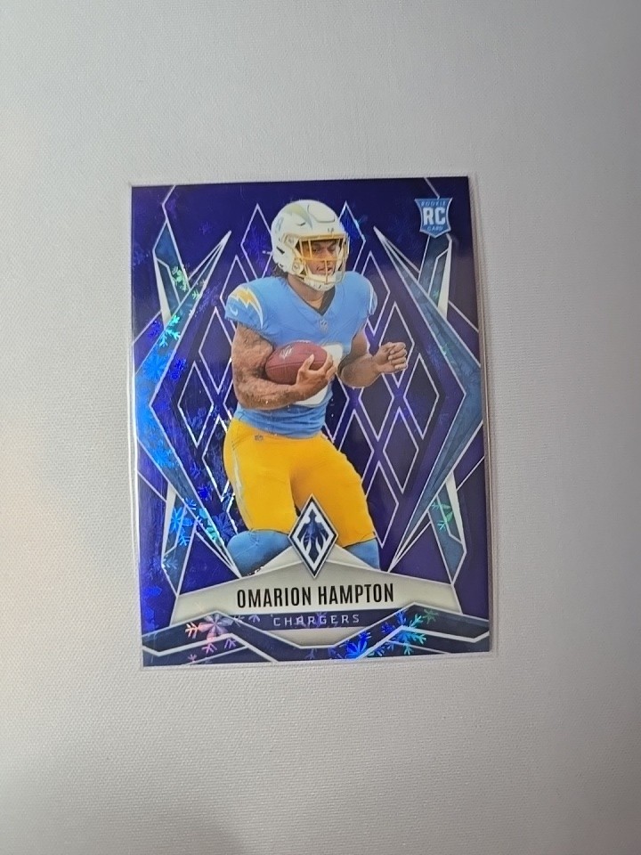 2025 Panini Phoenix - Rookies Omarion Hampton #192 Blue Winter /199 (RC)