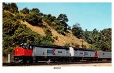 1980s Amtrak Locomotive and Cars on the Tracks Vintage Postcard