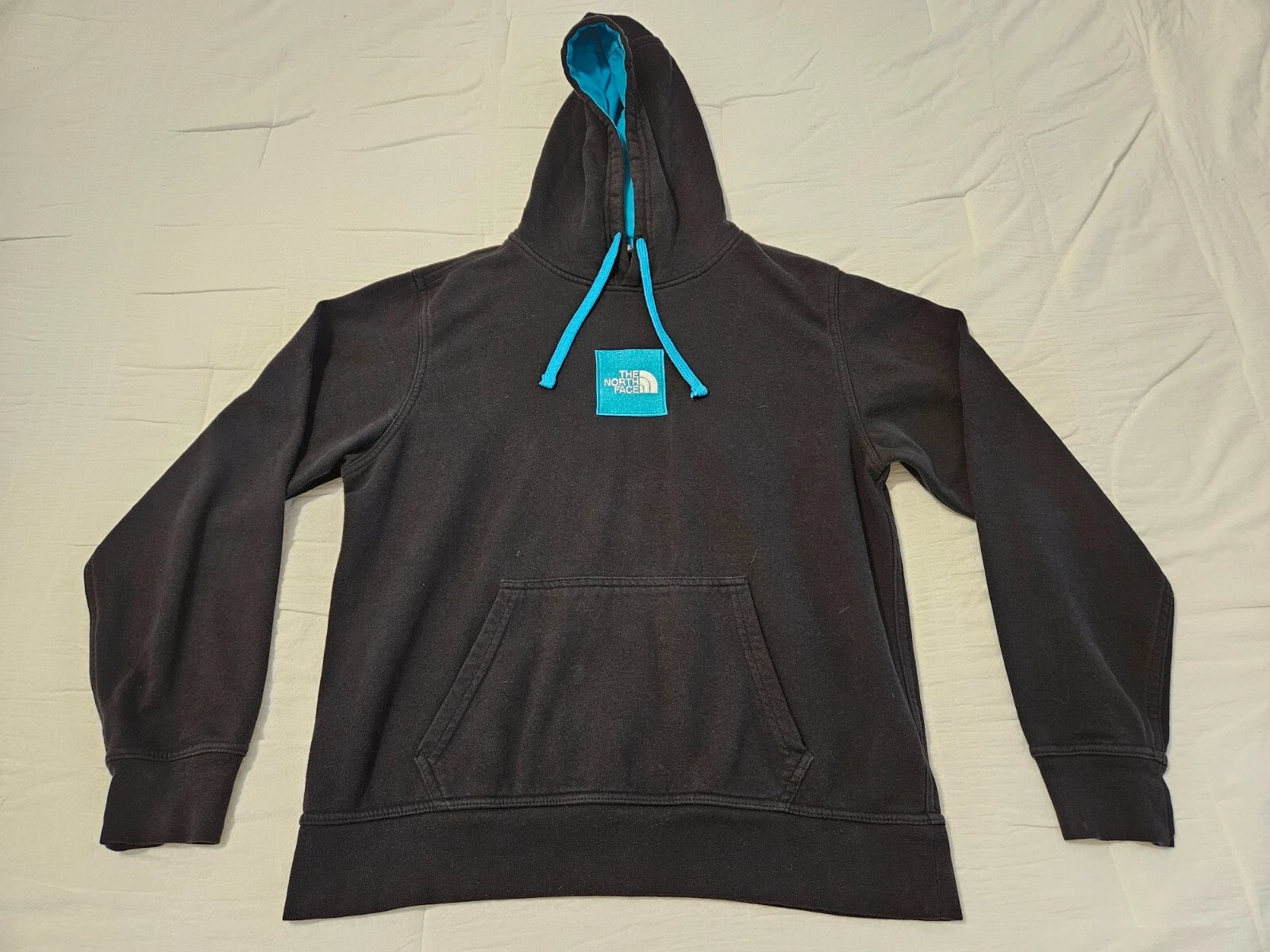 north-face logo teal blue jacket