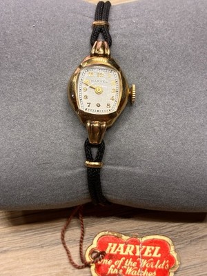 VTG NOS Harvel Women s watch  Manual Wind 17J Black GEMEX Strap. 1/20 18kt GF