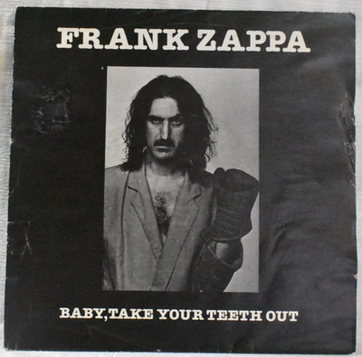 FRANK ZAPPA - BABY TAKE YOUR TEETH OUT /STEVIE'S SPANKING  -UK 7 in VINYL  -1984