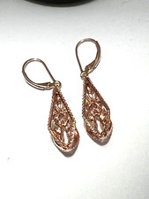 Rose gold over 925 Sterling silver dangle earrings ornate with CZ gemstones