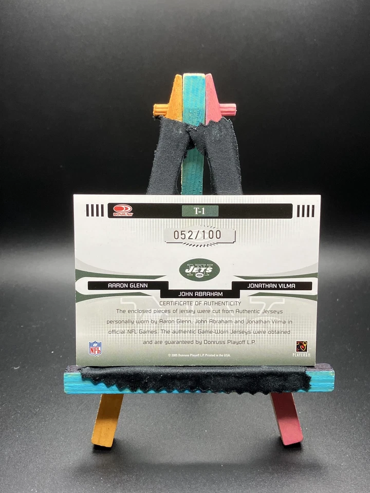 Camisetas Donruss Aaron Glenn, John Abraham, Jonathan Vilma 2005 usadas en el juego/100 Foto 2 de 2