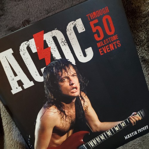 AC/DC - Through 50 Milestone Events - Hard Cover NEW - Foto 2 di 8