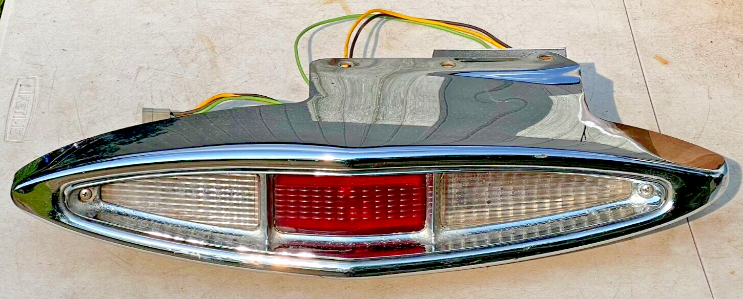1967-1968 Cadillac LH Rear Tail Light Housing Bucket Guide Lens with Chrome Surround