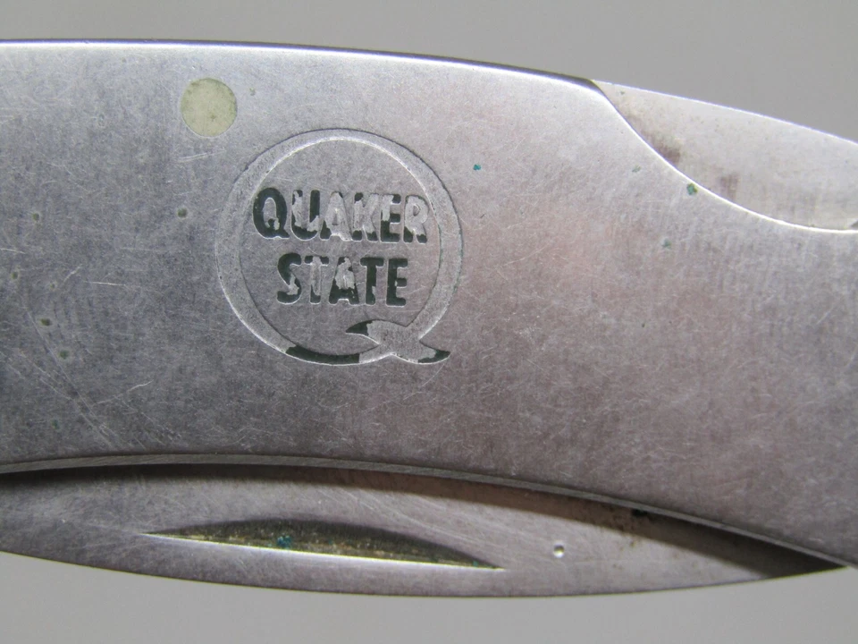 Navaja de bolsillo plegable vintage Zippo de acero inoxidable Quaker State con funda. Foto 4 de 4