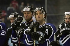Barrett Jackman Primus Worldstars stands with his teammates - Ice Hockey Photo