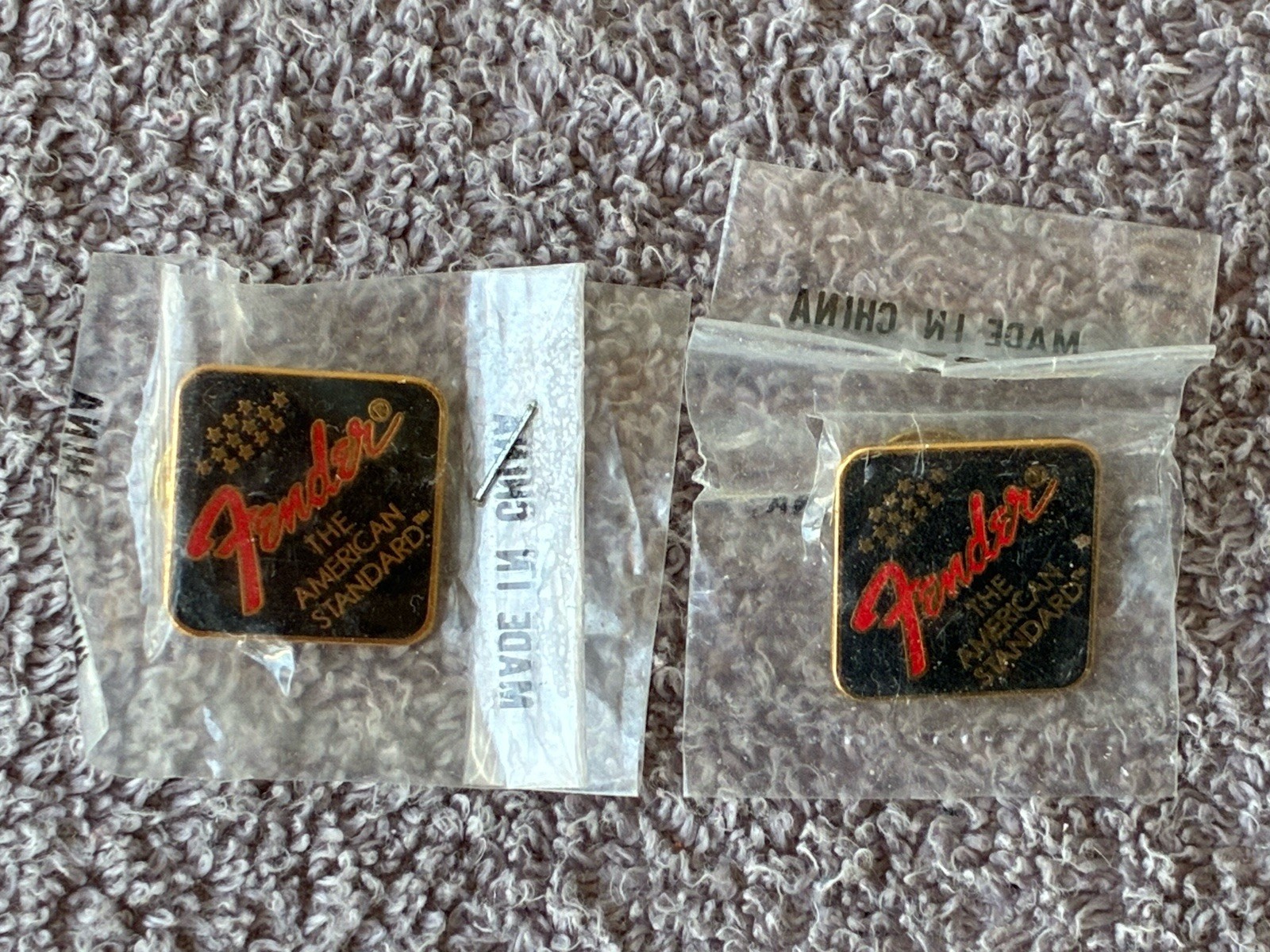TWO (2) VINTAGE FENDER GUITARS LOGO / EMBLEM LAPEL PINS  ~  NEW IN ORIGINAL PKGS.