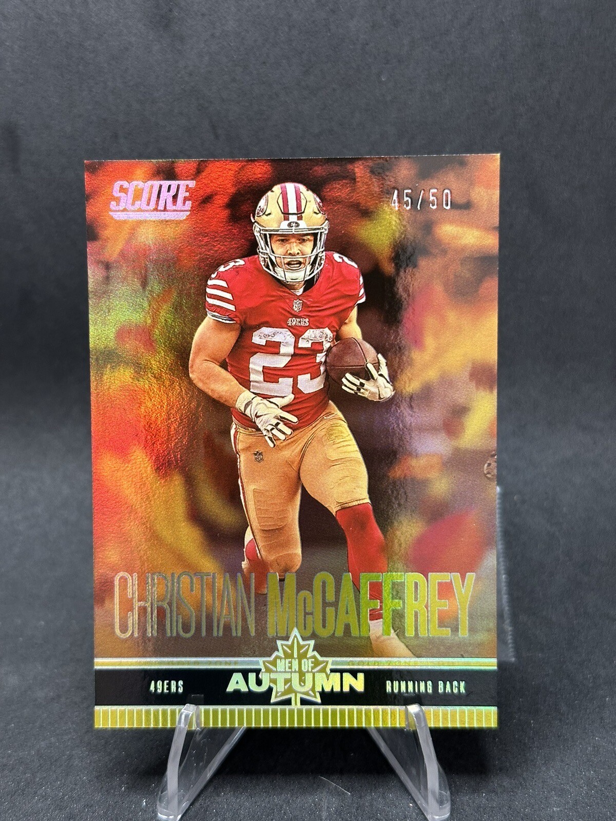2023 Score Football Christian McCaffrey Men of Autumn #13 Gold Zone /50 49ers