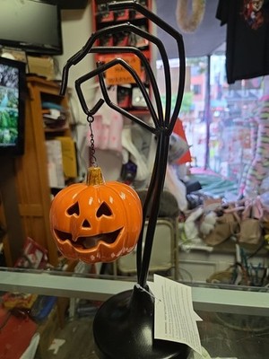 Halloween Hand Holding A Hanging Pumpkin. Lights Up