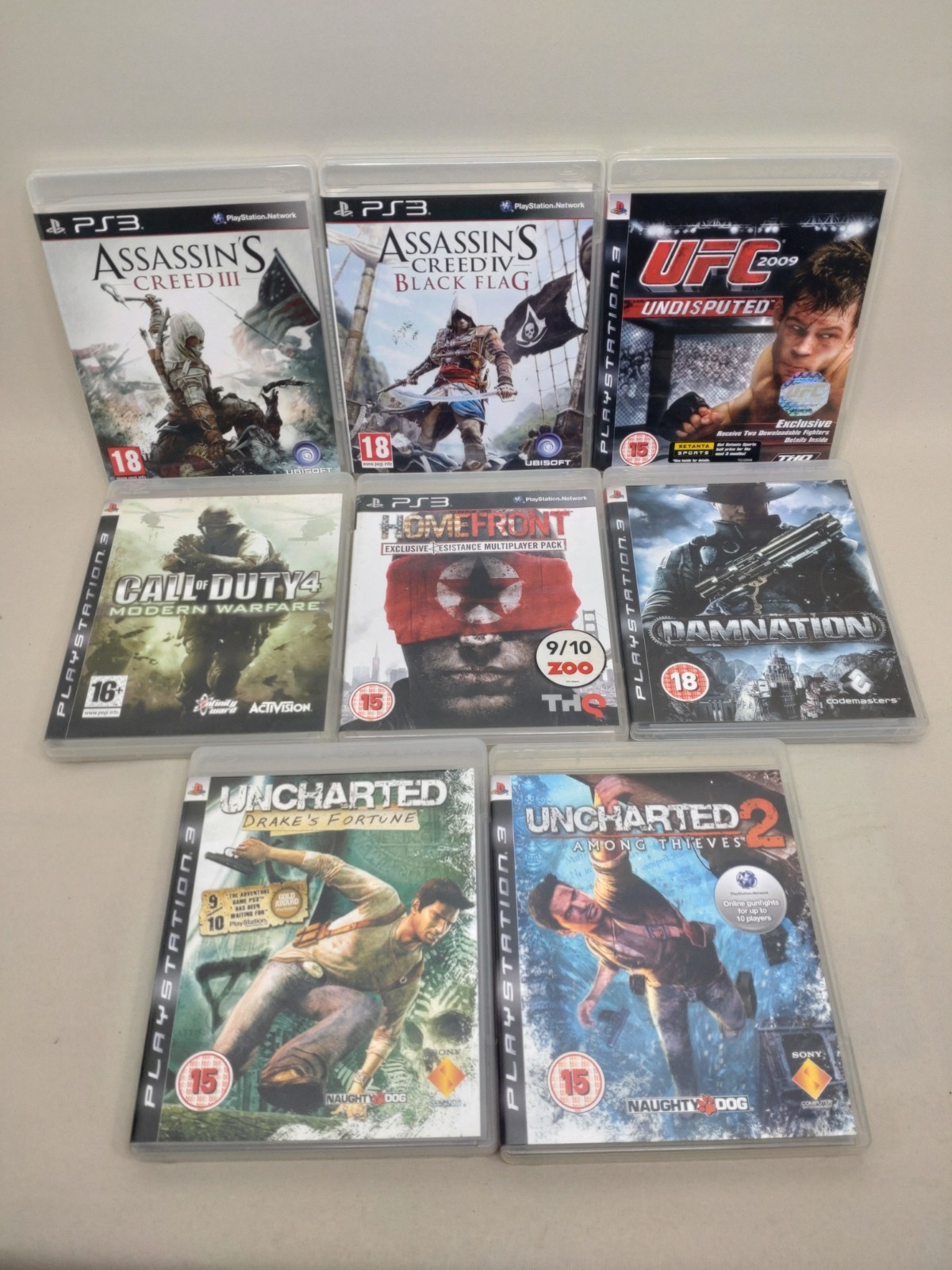 PlayStation 3  Bundle x8 Uncharted, Assassin’s Creed, COD MW2, UFC, Damnation