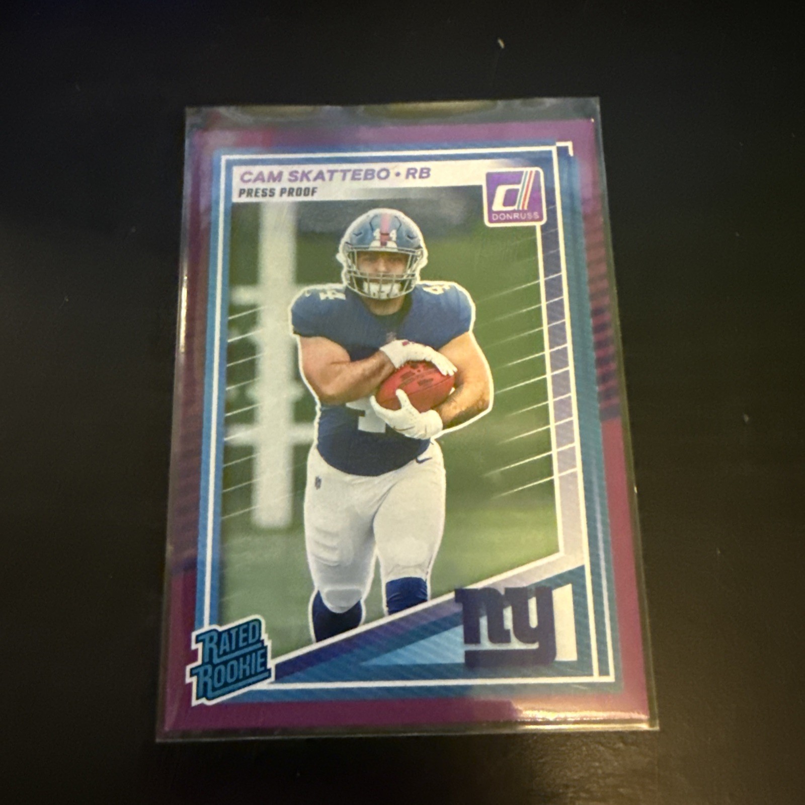 2025 Panini Donruss - Rated Rookie Cam Skattebo #302 Purple Press Proof (RC)