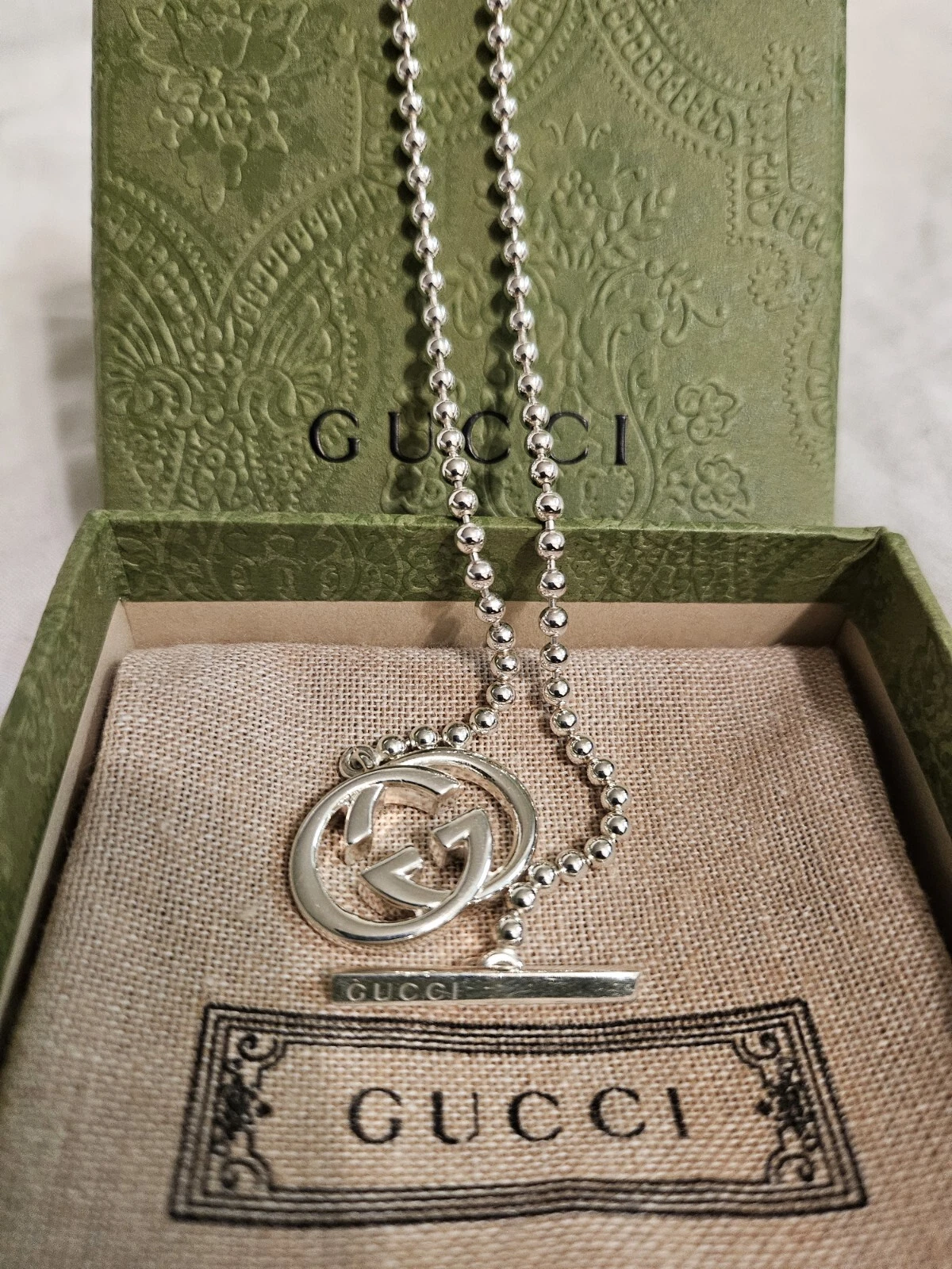 Collier ras du cou à bascule chaîne boule double G imbriquée en argent sterling Gucci GG