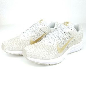 white and gold nike running shoes