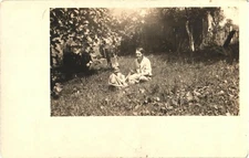 An Old Photo of A Woman And A Little Boy Playing On The Grass Postcard