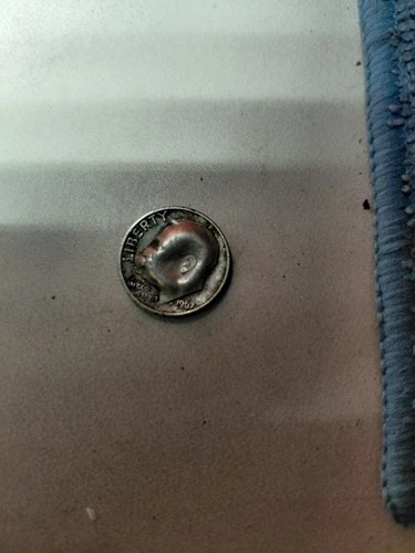 1967 Silver Roosevelt Dime Error the head has a bubble in it.