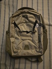 Tan Puma backpack with mesh texture front logo and multiple zipper pockets