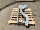 Silver 13-18 RAM 1500 front left driver frame apron radiator support with bent-up design on concrete pallet.