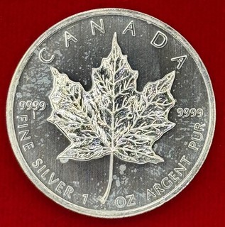 2010 Canadian Maple Leaf 1 oz .999 Fine Silver $5 Toning spots Hazing scruffy