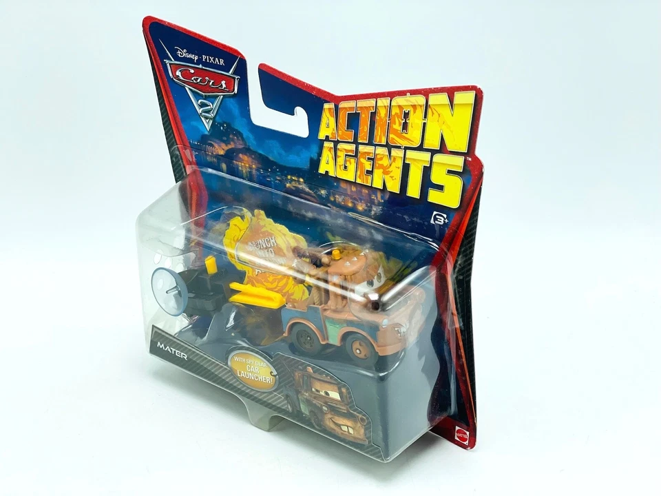 Disney Pixar Cars 2 agentes de acción Mater con lanzador de autos Spy Gear #V3020 camión de remolque Foto 2 de 4