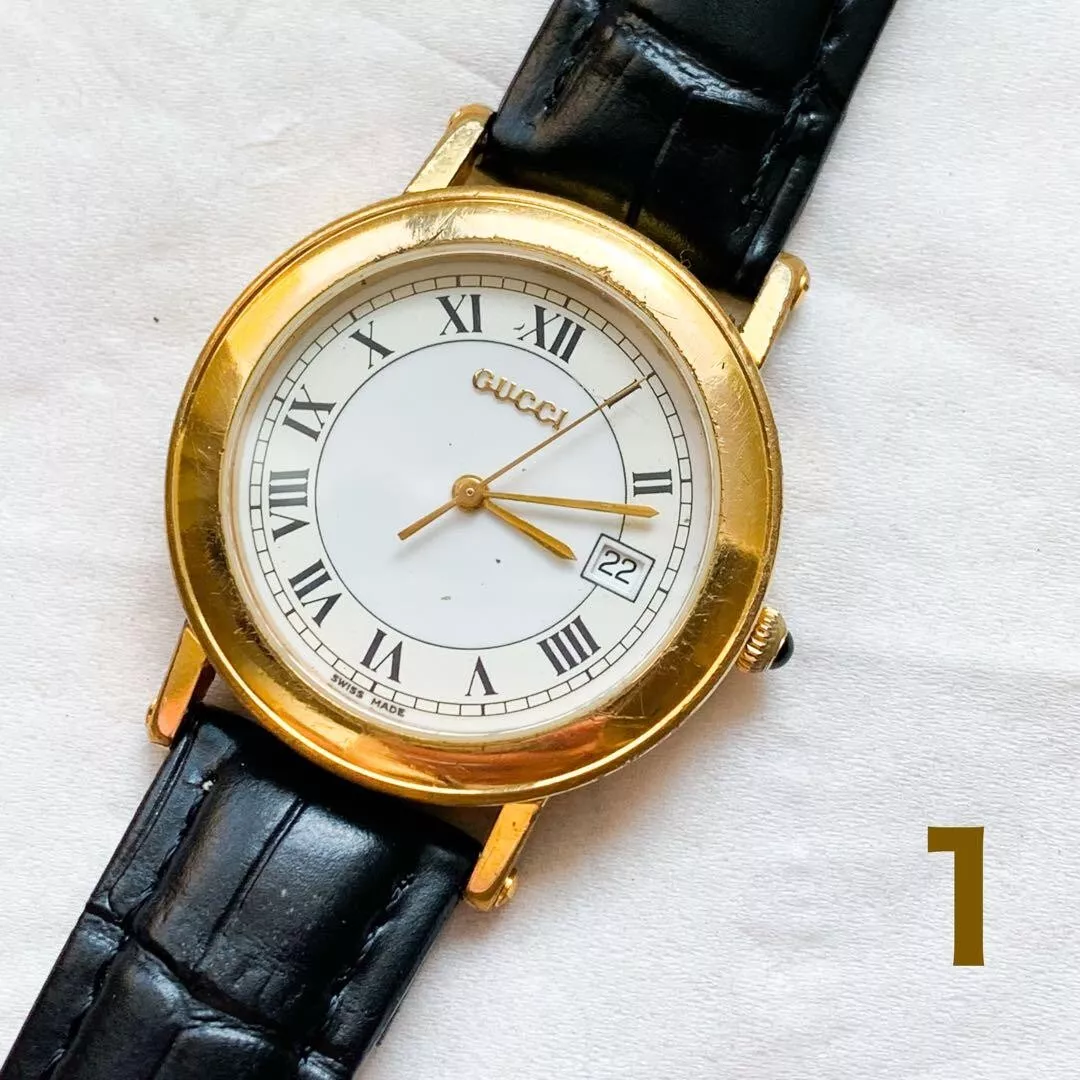 Montre homme vintage GUCCI 7200M cadran blanc romain date quartz QZ
