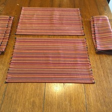 Pier One Placemats Set Of 4 multi colored Beaded Accents with Stripes