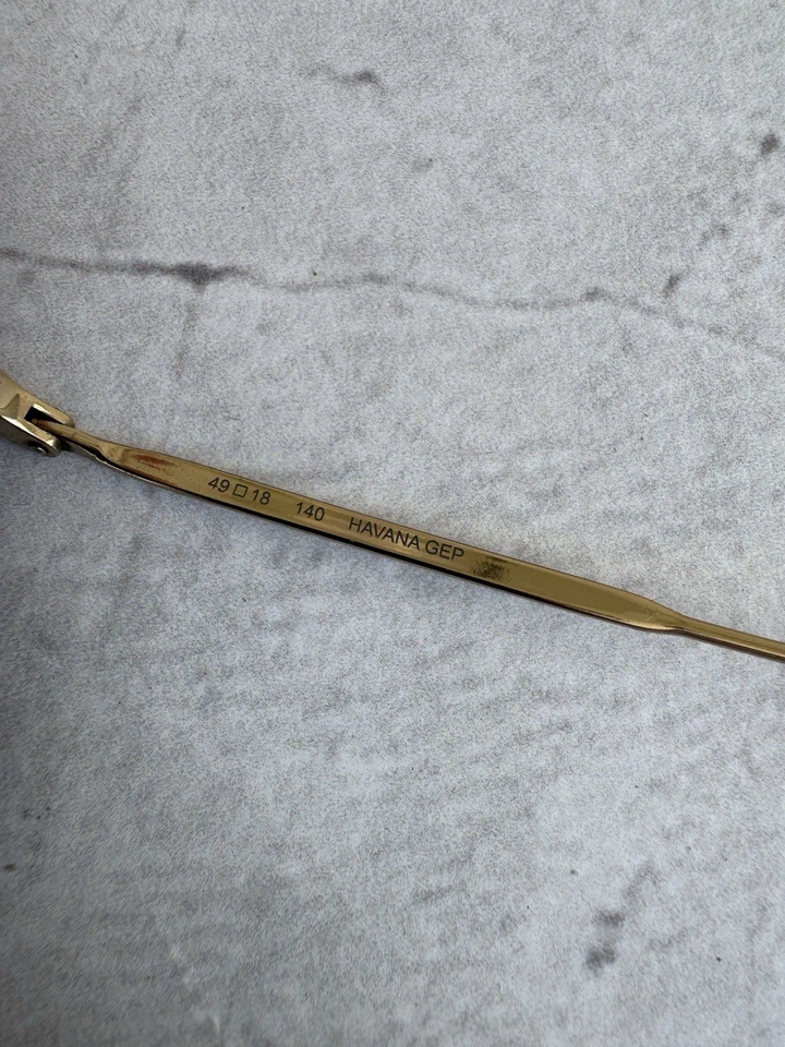 Marco de gafas Flexon ovalado dorado titanio memoria metal ligero Foto 4 de 4