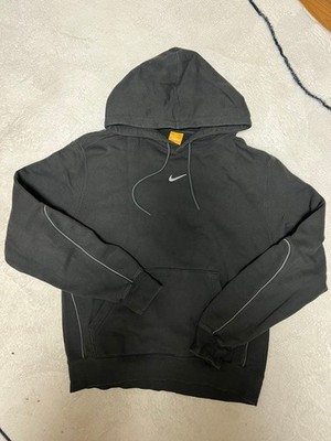 NIKE NOCTA Herren Hoodie schwarz reflektierende Paspel Drake Central Swoosh F...