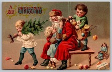 Postcard A Jolly Christmas Santa Sitting Little Boys and Girls Toys Emboss *1207