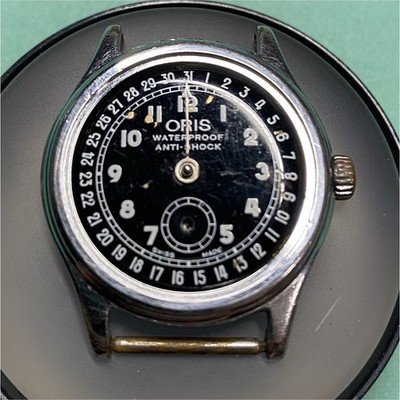 Oris 704 movement in 31.5 mm case. For parts only. Read the description!