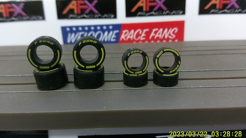 2 SETS AFX RACING HO SCALE P-ZERO YELLOW LETTERED TIRES FROM MCLAREN F1 CHASSIS