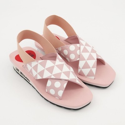 Love Moschino rosa flache Sandalen mit Kreuzriemen