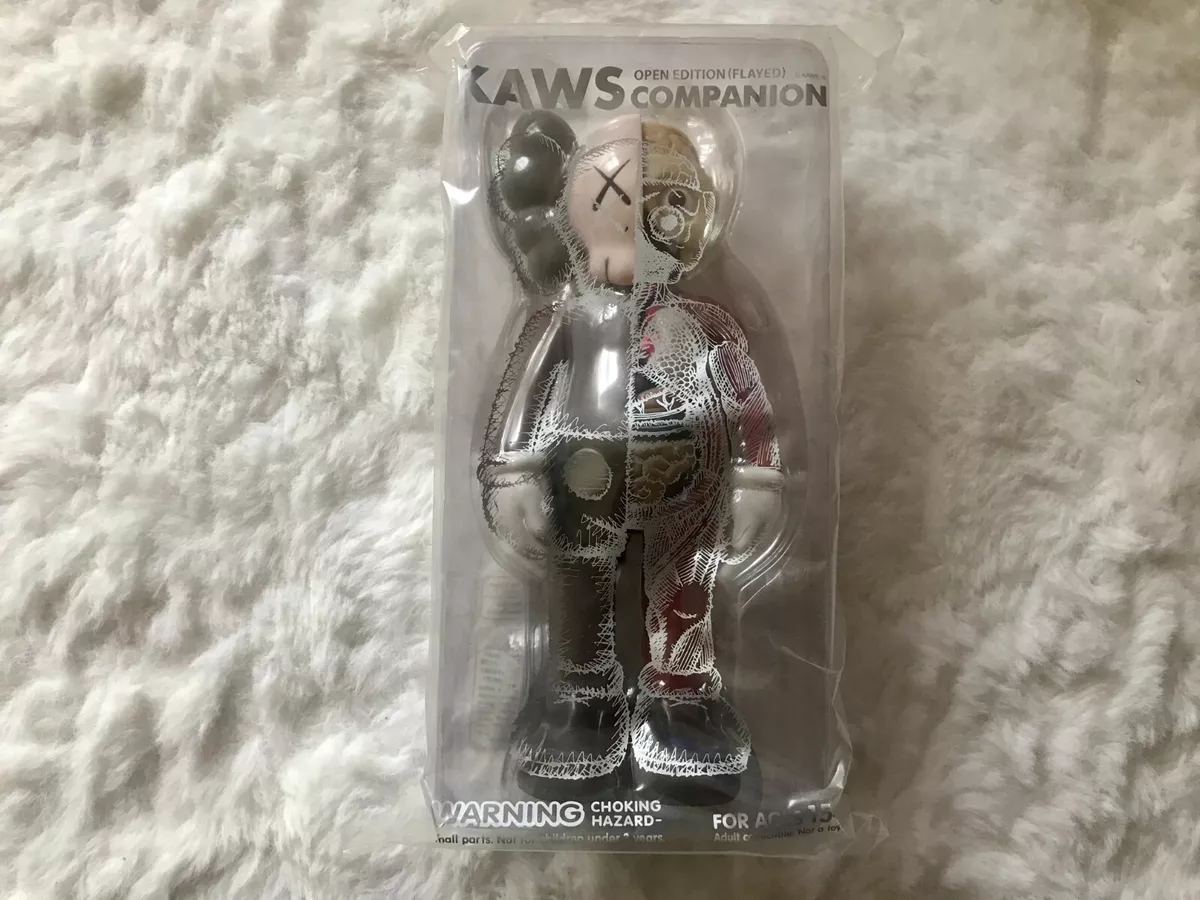 KAWS: open edition keychain.