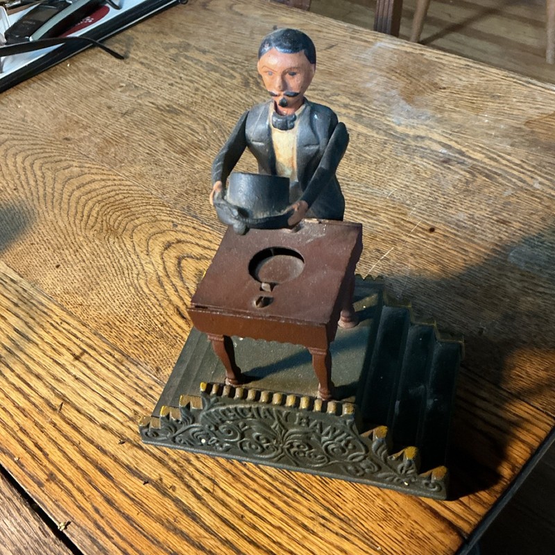 Mechanical Bank Cast Iron Man Holding Hat at Table Collectible