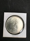 CANADA SILVER DOLLAR 1966 UNCIRCULATED 80% SILVER SLIGHTLY TONED..