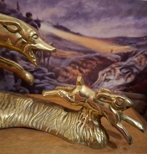 A cast brass sculpture of hare coursing interest in the form of a hare and hound