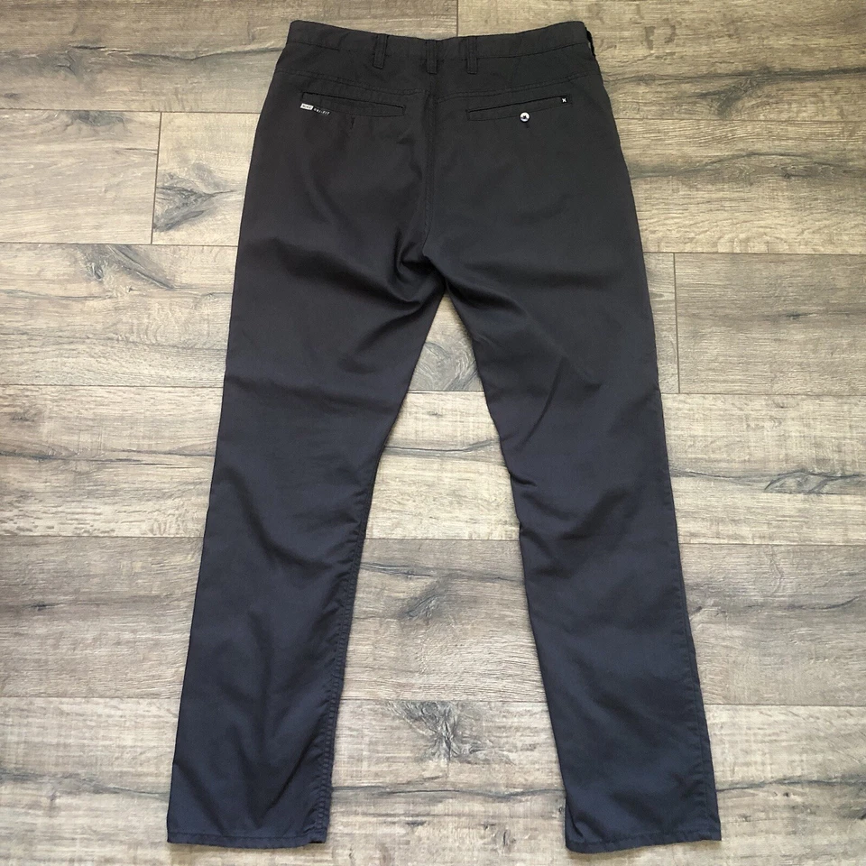 Pantalones chinos de trabajo Hurley Nike Dri Fit frente plano pierna recta para hombre 31x30 negros Foto 2 de 4