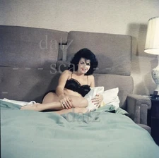 1950s Transparency-sexy brunette pinup girl on bed-cheesecake t457332