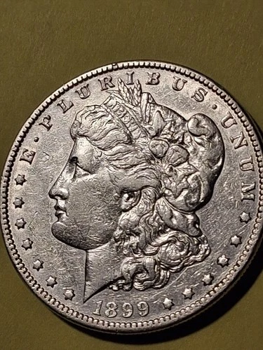 1899-P MORGAN SILVERDOLLAR. AU CONDITION. 330,000 MINTAGE LOW.