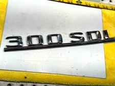 Genuine Mercedes W126 1987 300SDL diesel rear deck lid PLASTIC silver 1 Emblem