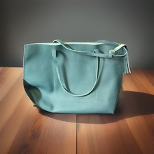 Borsa a tracolla donna turchese ciottoli con nappa, chiusura a scatto, tasche interne