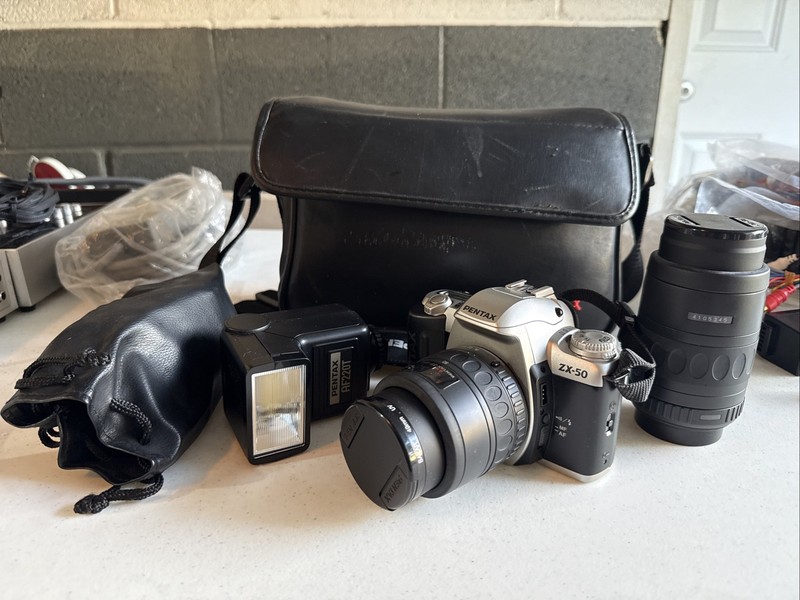 Pentax ZX-50 Camera With Case, AF220T Flash And 2 Lenses