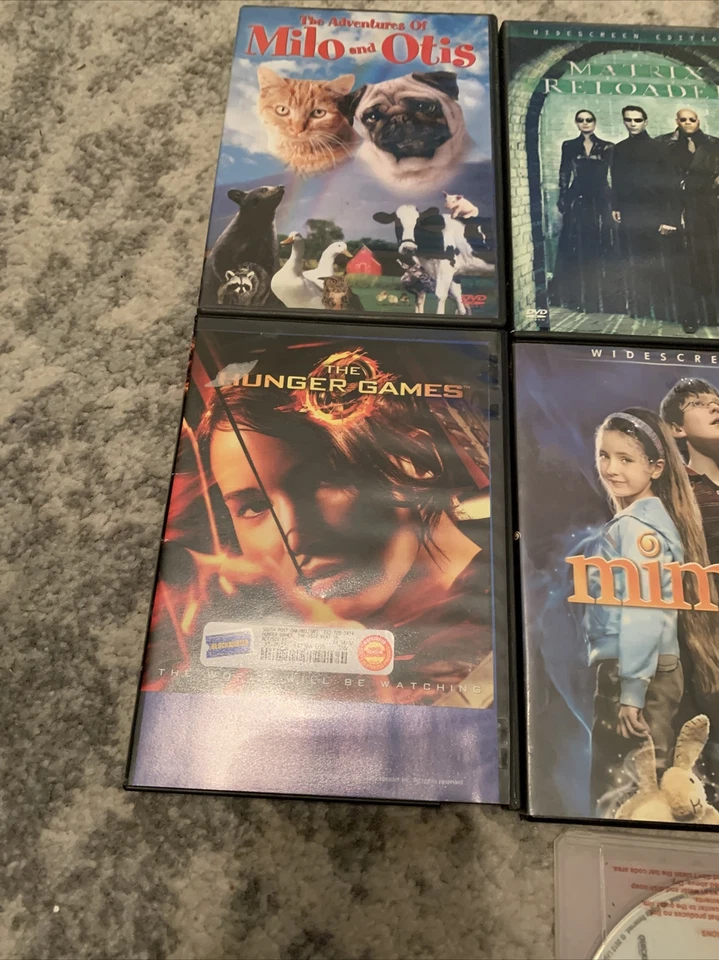 Lot Of 7 Movies DVD Matrix Hunger Games Bourne Mimzy Milo & Otis - Image 2 of 4