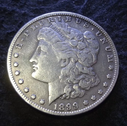 1899 P Morgan Silver Dollar - Choice Fine F+ details from the Philadelphia mint