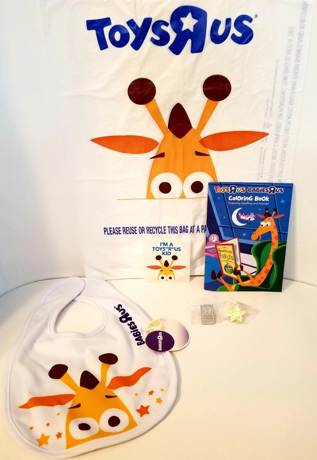 Geoffrey Babies R Us baby bib, Toys R Us Coloring Book, Pins & Plastic Bag