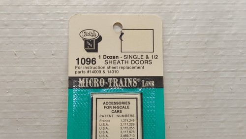 N Micro Trains 1 Dozen Single & 1/2 Sheath Doors 1096 - Picture 2 of 3