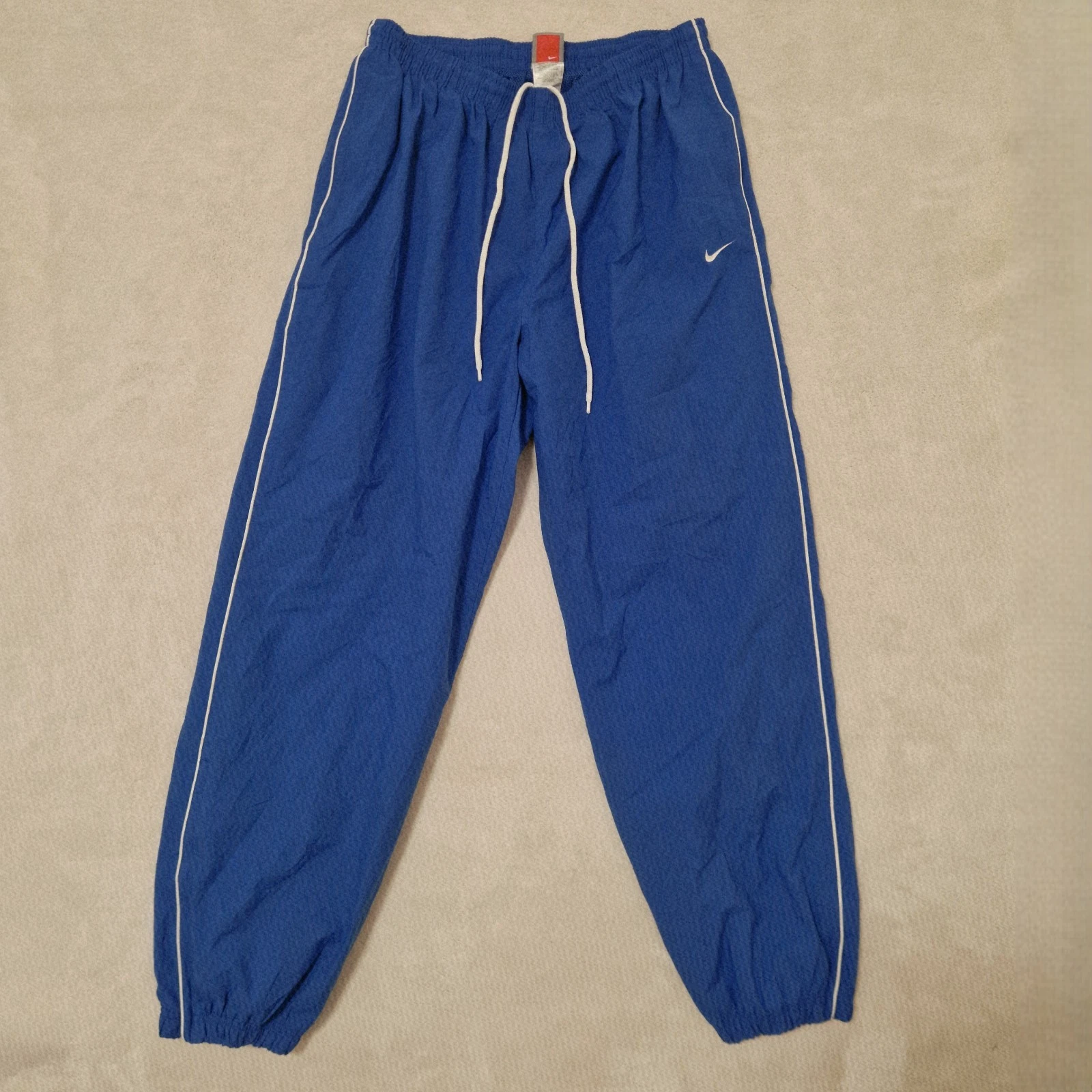 Vintage Nike Team Track Pants Mens L Blue Windbreaker Ankle Zip Pocket Jogger
Opens in a new window