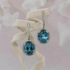 4Ct Oval Cut Lab-Created Blue Topaz Drop/Dangle Earrings 14K White Gold Plated
